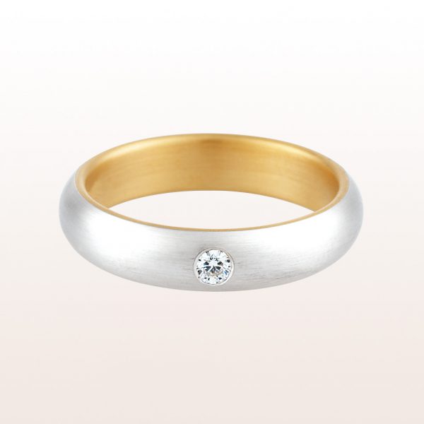 Wedding ring with brilliants 0,07ct in platinum and gold. Width from 4mm to 7mm.